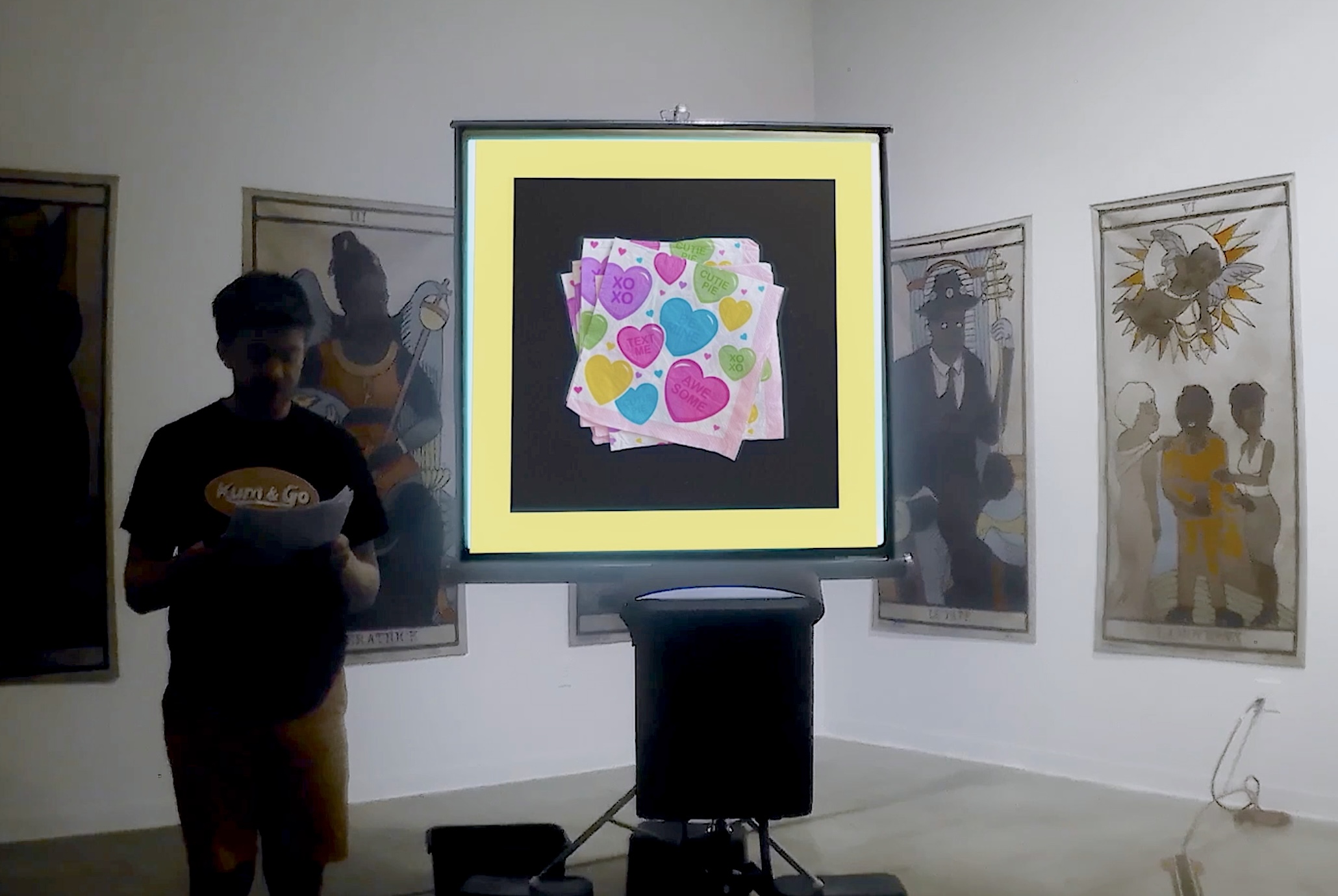 Ben Nicholson performing in front of a projector